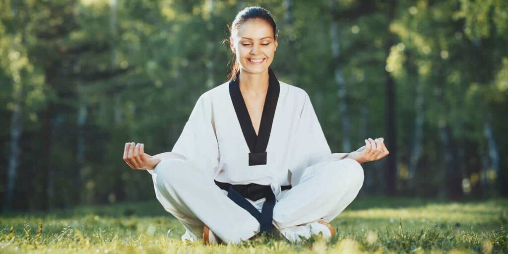 Martial Arts Lessons for Adults in Arlington VA - Happy Woman Meditated Sitting Background