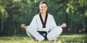 Martial Arts Lessons for Adults in Arlington VA - Happy Woman Meditated Sitting Background
